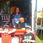 My wife hard at work at the booth and dealing with two clowns.