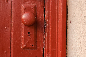 Doorknob on a red door.