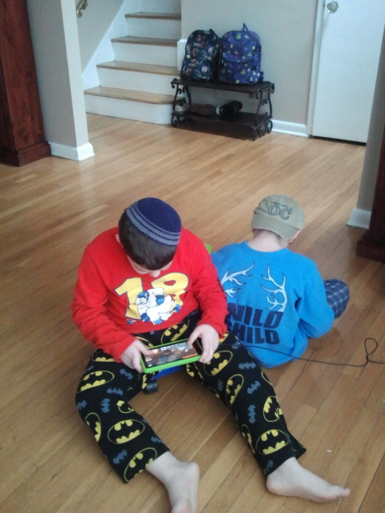 Boys focused on kindle Minecraft