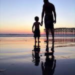 Father and son on the beach.courtesy of Google.com