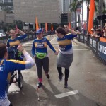 Anny and her counselor crossing at the finish line.